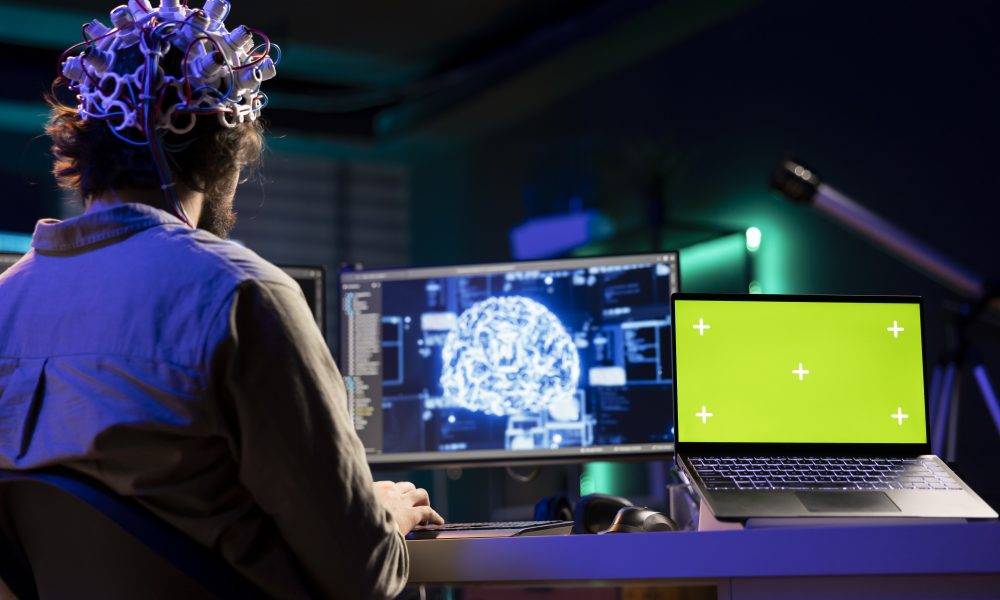 ai pc Isolated screen laptop and man with EEG headset doing brain transfer into virtual world, merging with artificial intelligence. Admin using neuroscience and chroma key notebook to gain digital soul