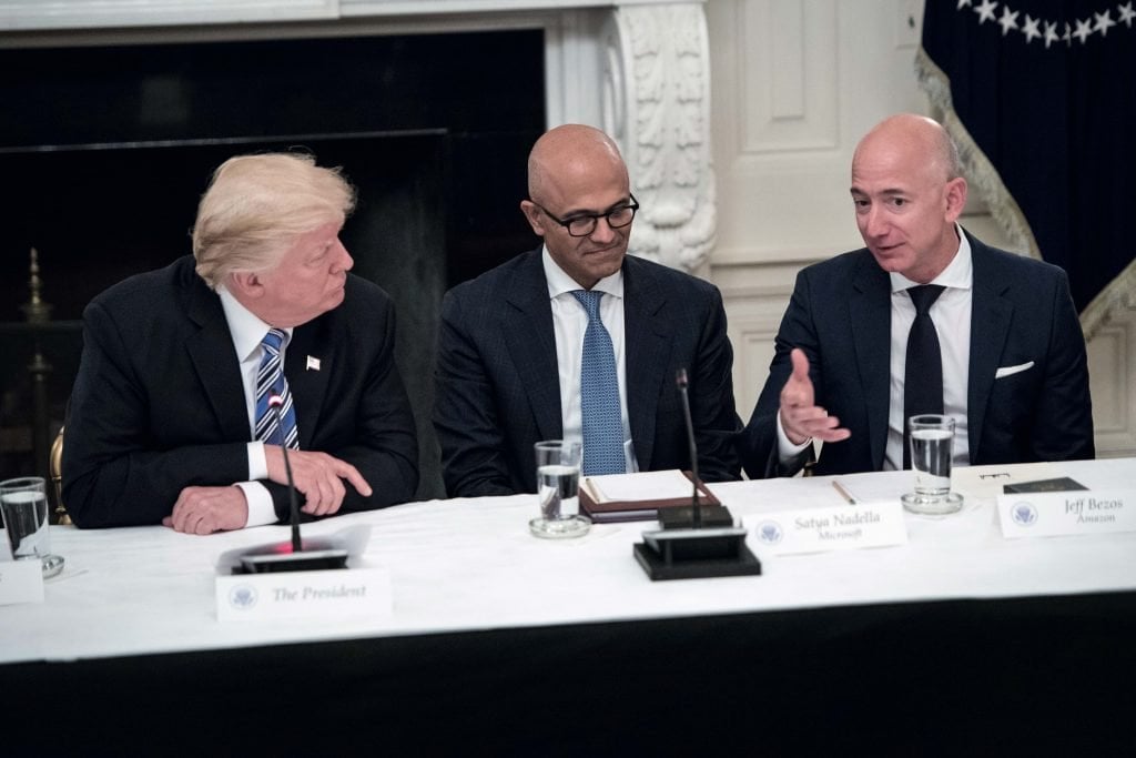 how bezos Bezos, right, with Trump and Microsoft CEO Satya Nadella, center, at a White House technology roundtable in 2017.(圖片來源:Photo by Jabin Botsford/The Washington Post via Getty Images)